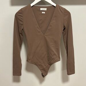 Babaton Aritzia Contour long sleeve bodysuit.